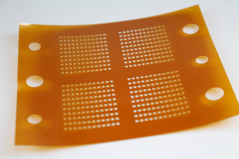 Hole Drilling in Polyimide Films
